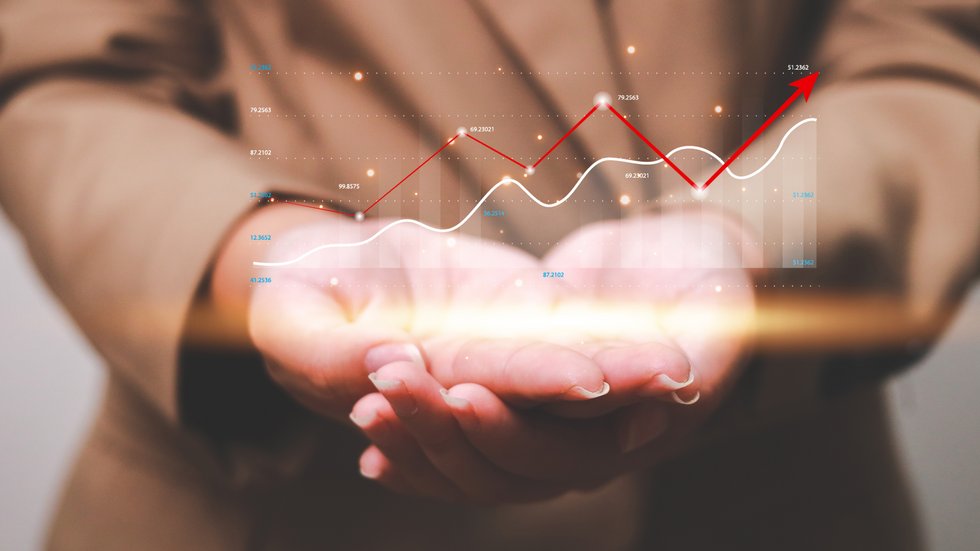 Widok wirtualnego wykresu trzymanego na dłoniach