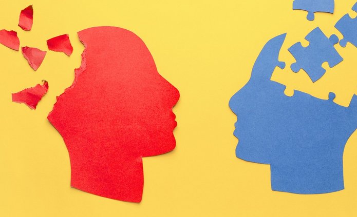 Grafika przedstawia dwie głowy z mózgiem w formie puzzle